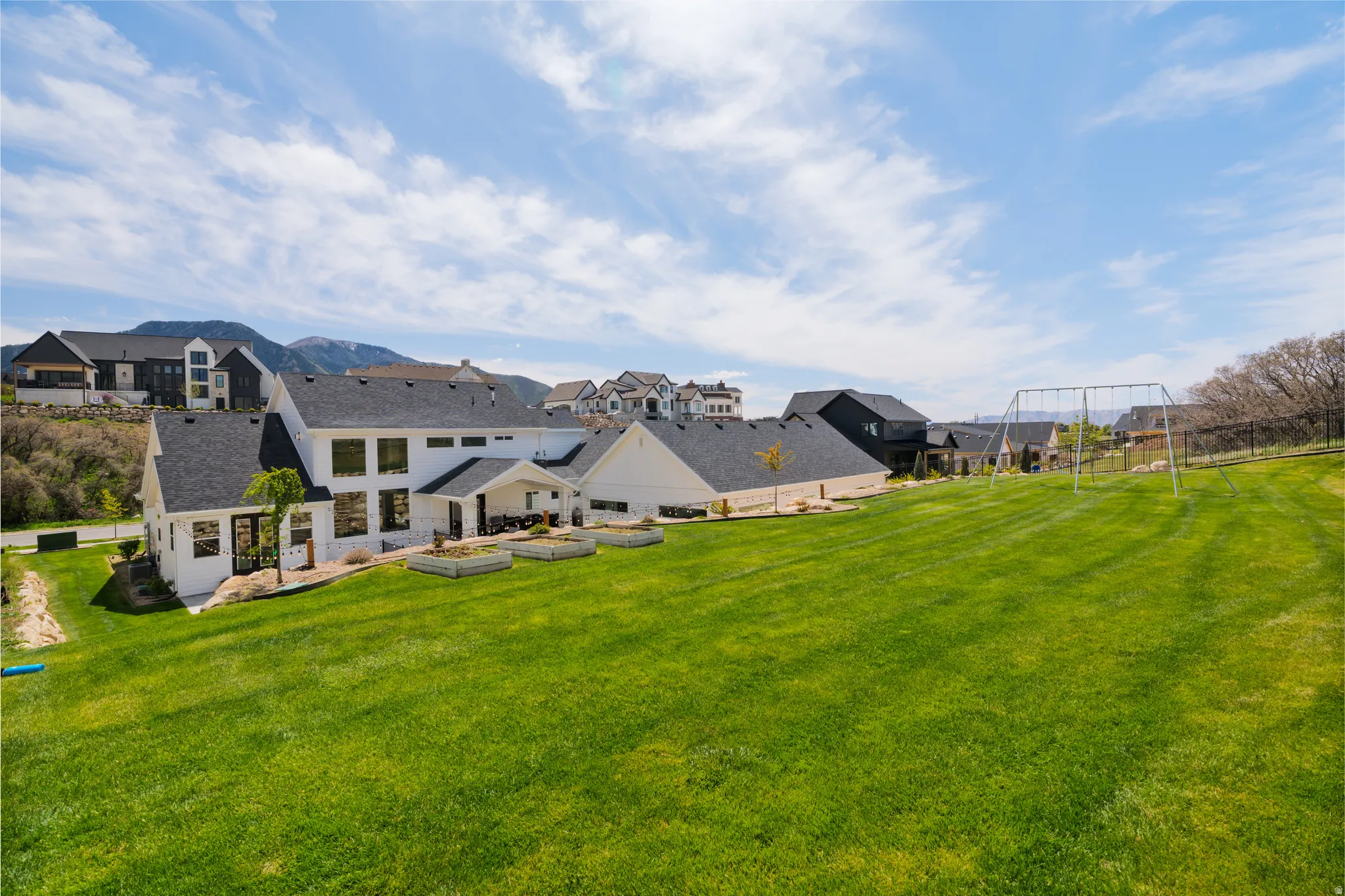 Back of property featuring stone siding