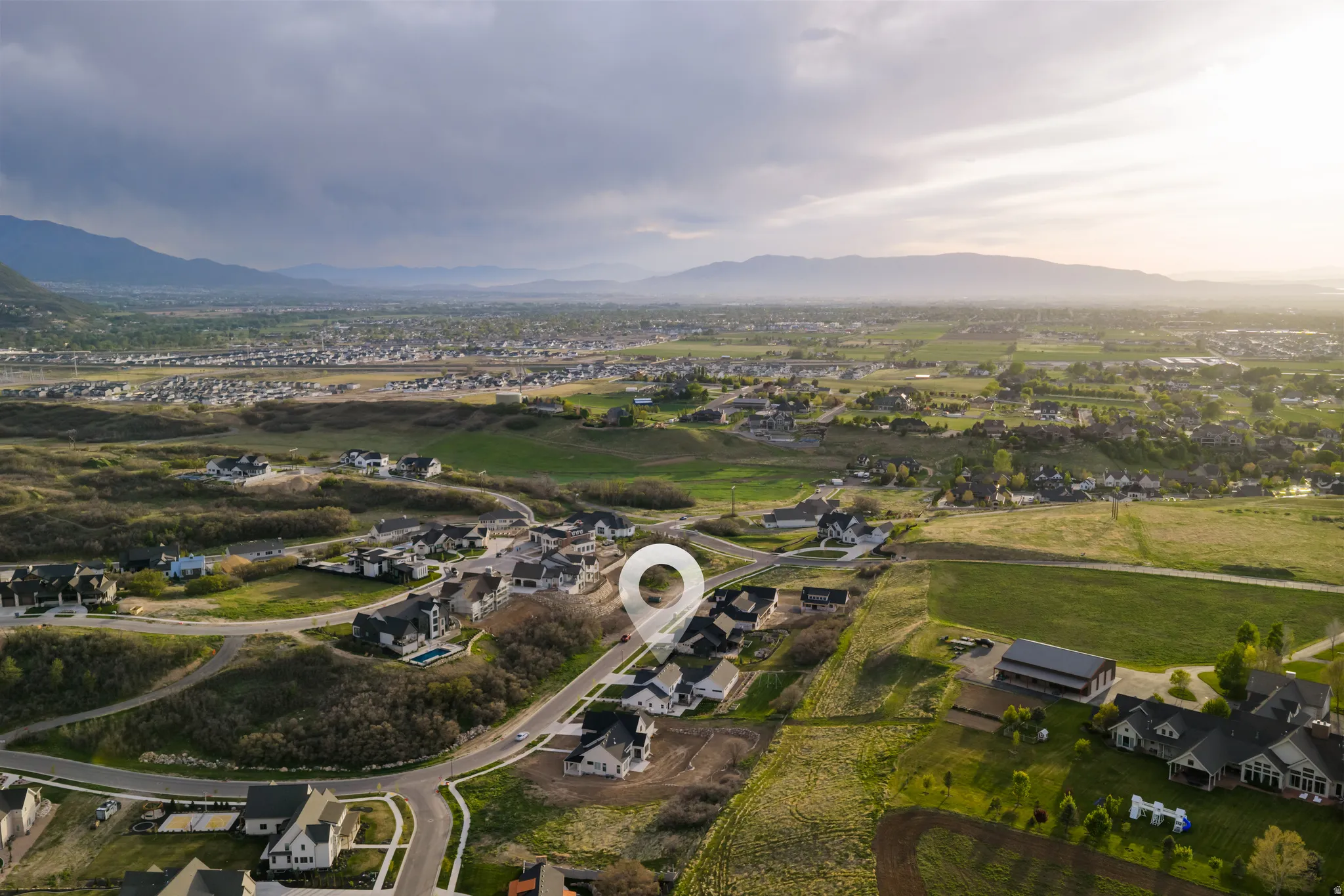 Aerial view of residential area featuring mountains