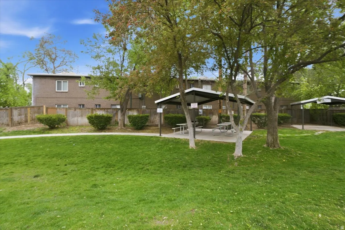 Fenced backyard with a patio area