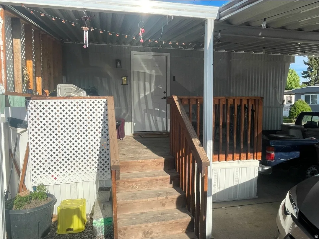 Wooden deck featuring a grill