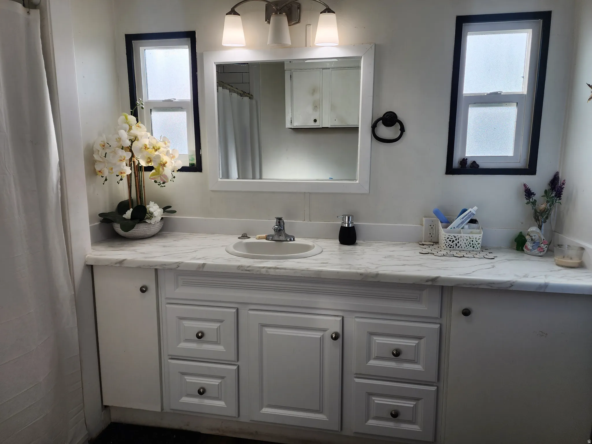 Bathroom with vanity and a shower with curtain