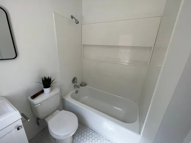 Bathroom with vanity and shower / washtub combination