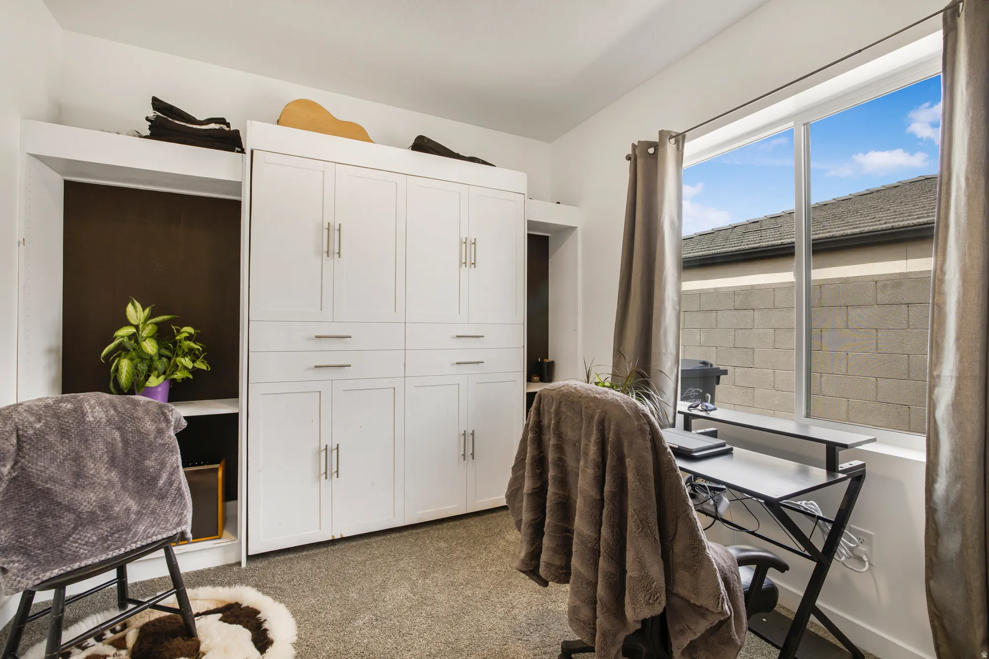Office area featuring light colored carpet