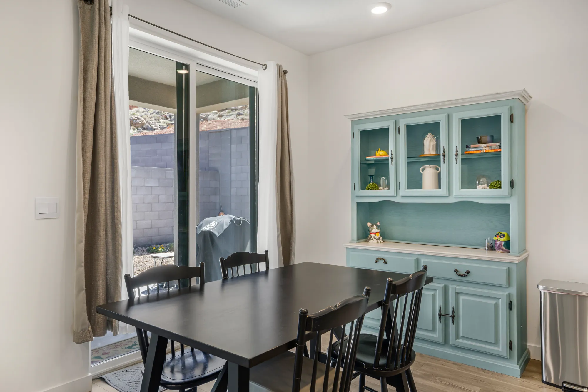 Dining space featuring light wood-type flooring and baseboards