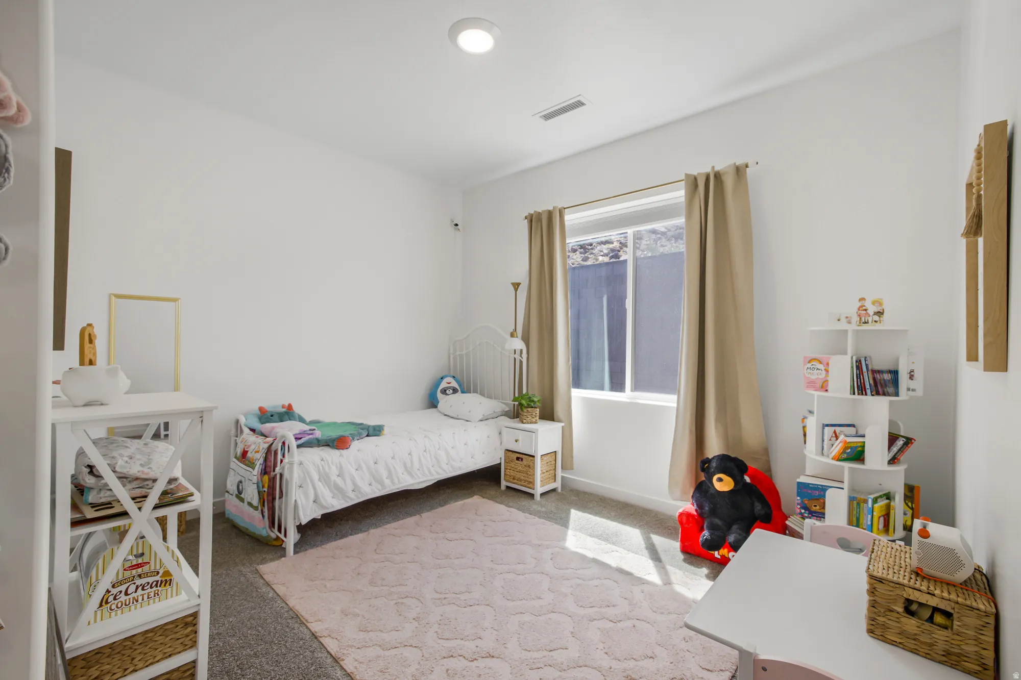 Carpeted bedroom featuring baseboards