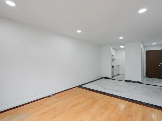 Empty room with recessed lighting and light wood-style floors