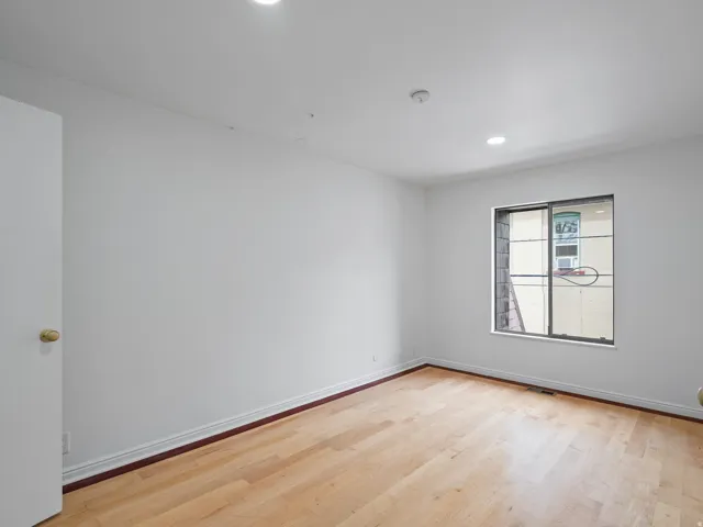 Spare room featuring light wood finished floors and recessed lighting
