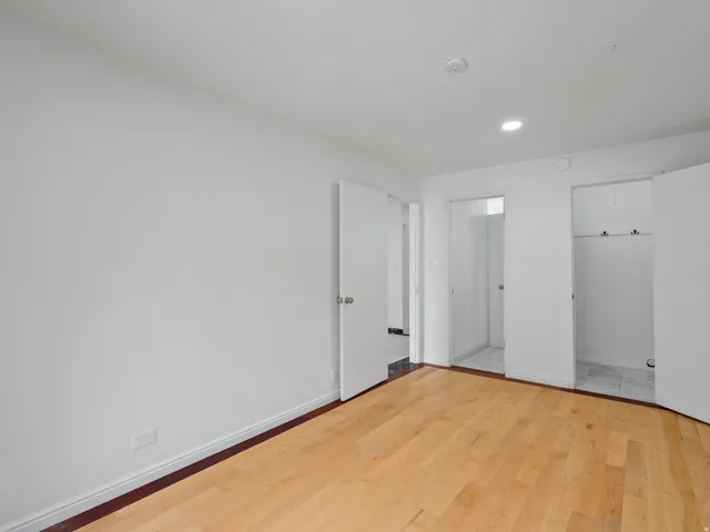 Unfurnished bedroom with light wood-style floors, a closet, and recessed lighting