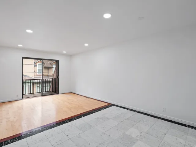 Unfurnished room featuring inlaid floor details and recessed lighting