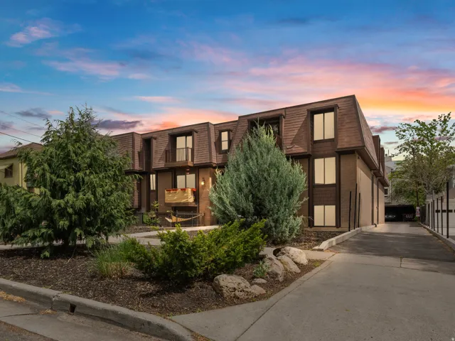 Property at dusk featuring driveway