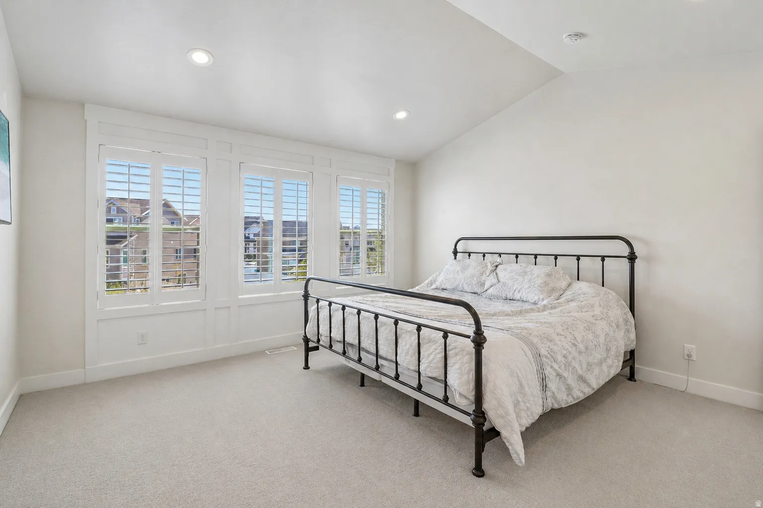 Master bedroom with vaulted ceilings