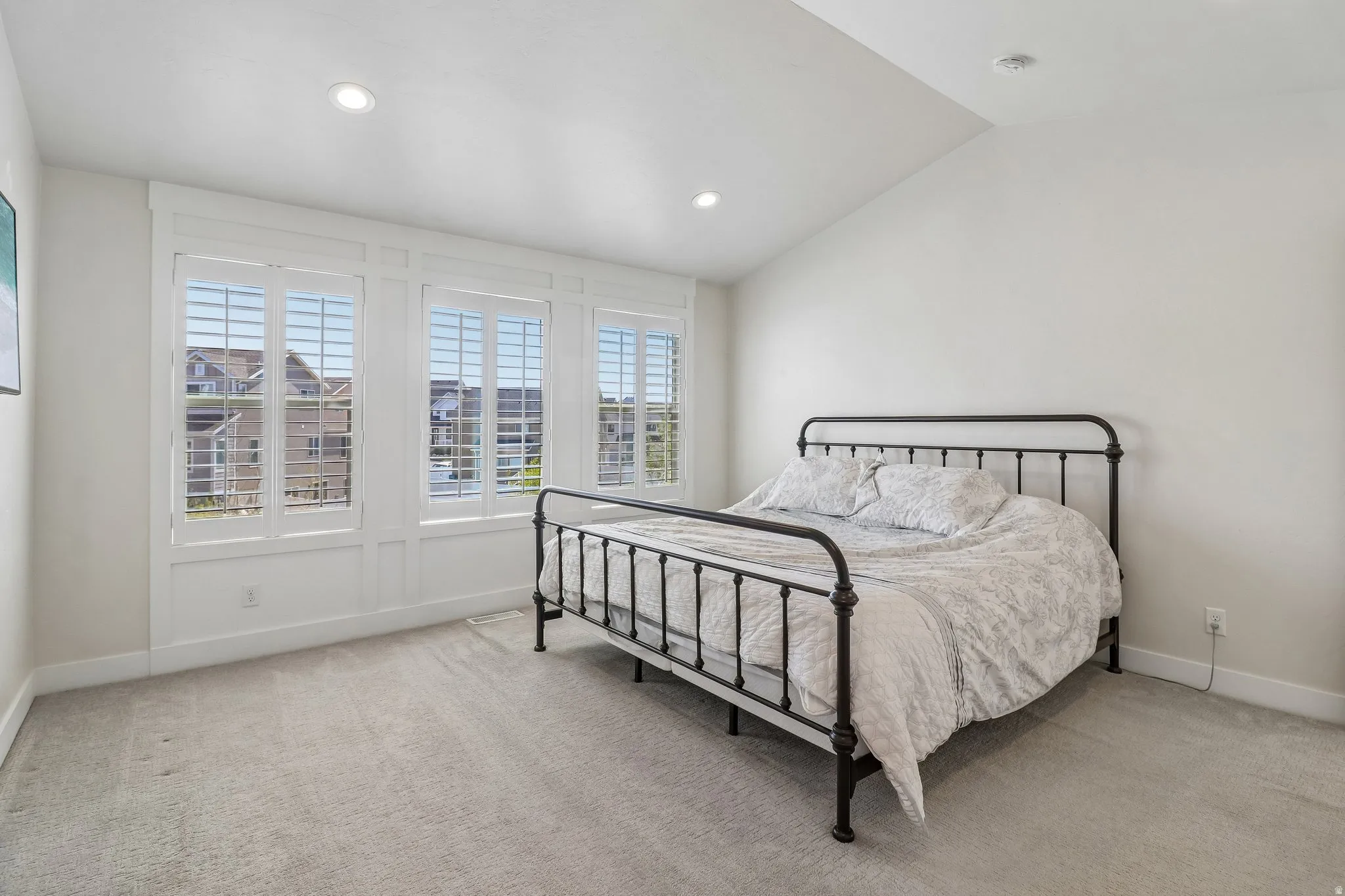 Master bedroom with vaulted ceiings