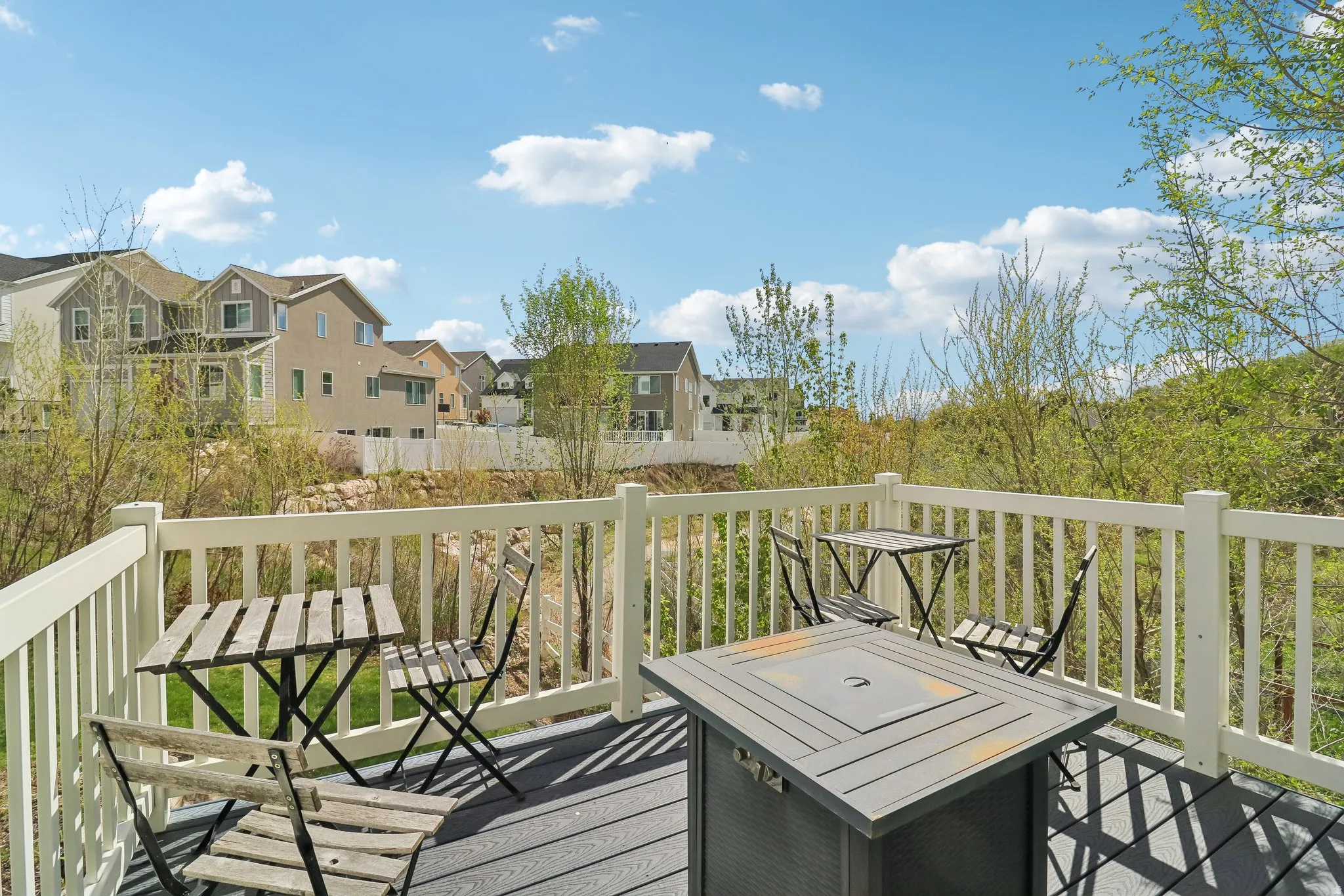 Deck with outdoor dining area and a residential view