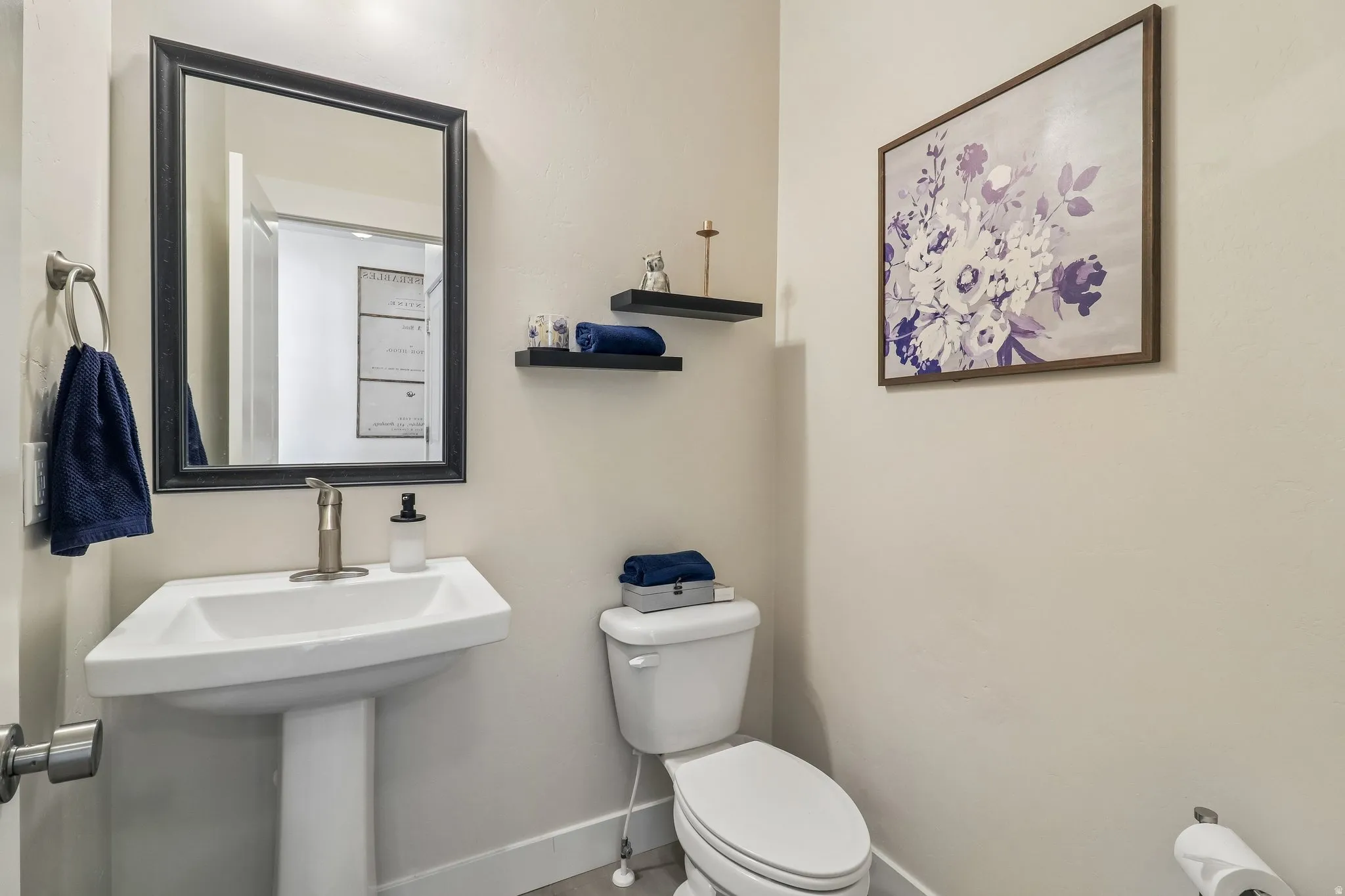 Bathroom featuring toilet and baseboards