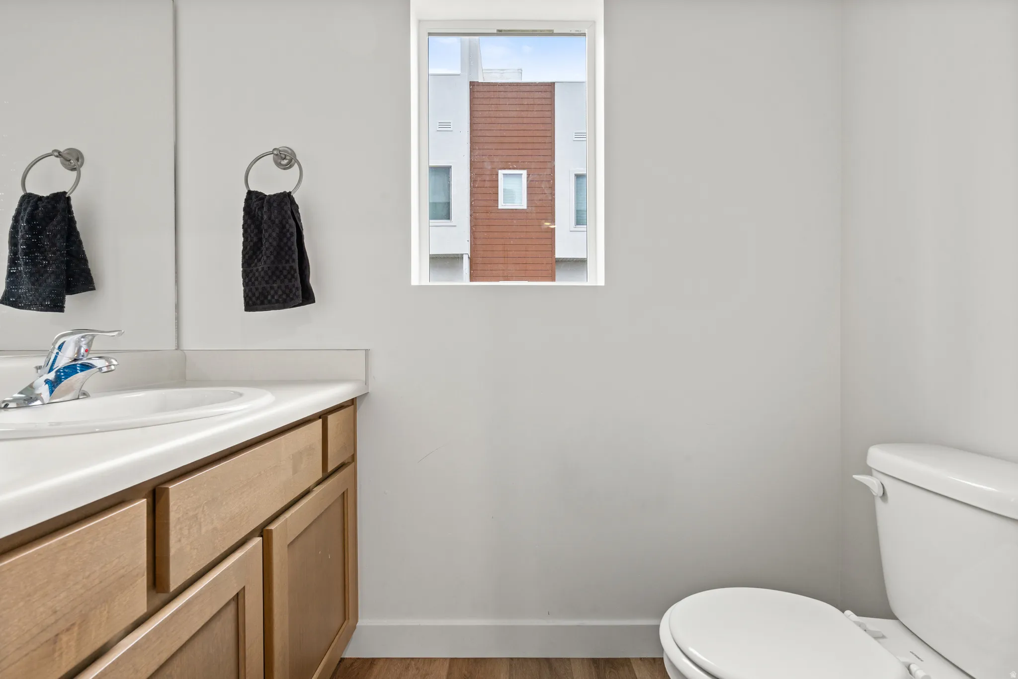 Bathroom featuring vanity and light wood-style flooring