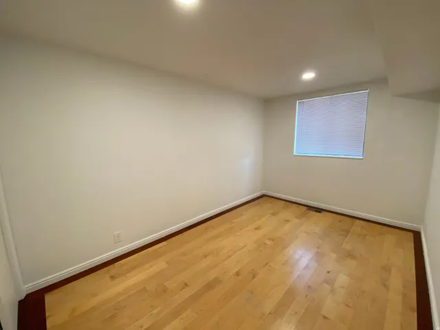 Spare room featuring light wood-style flooring and recessed lighting