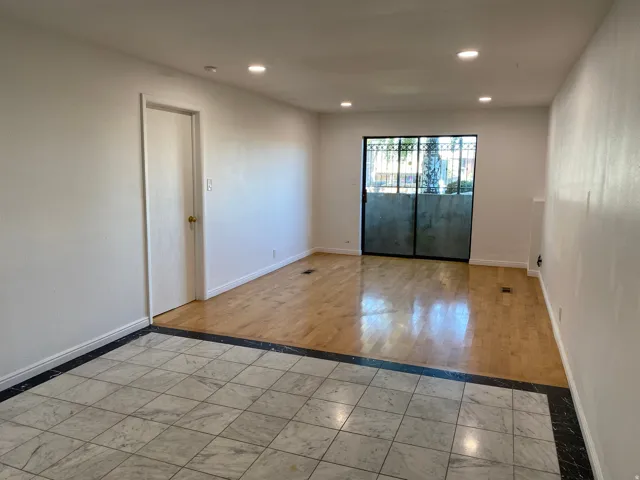 Empty room featuring recessed lighting, light tile patterned floors, and inlaid floor details