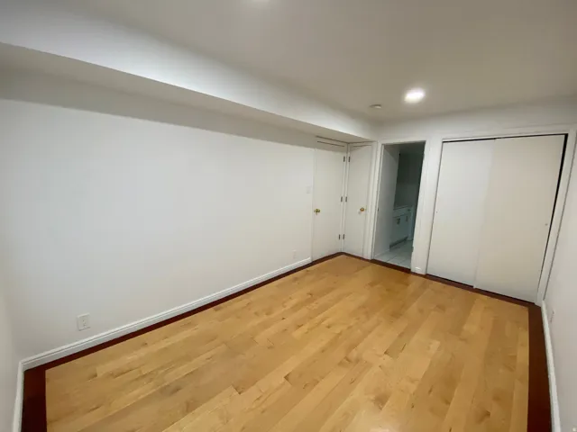 Unfurnished bedroom featuring light wood-type flooring, a closet, and recessed lighting