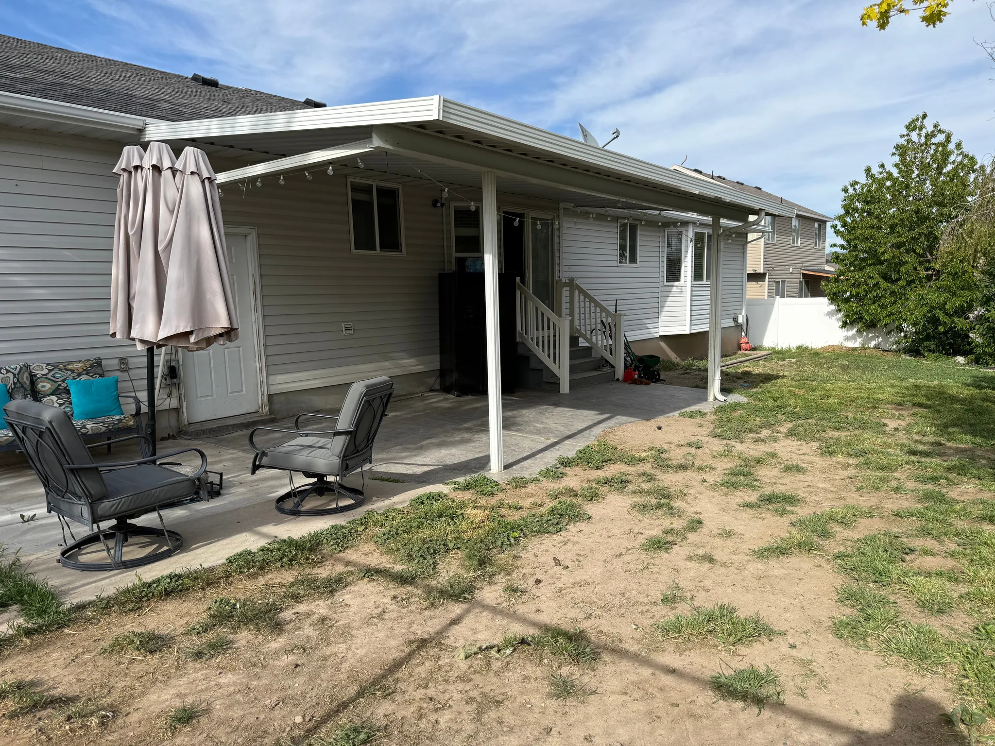 Rear view of house featuring a patio area and entry steps