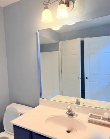 Bathroom featuring vanity and toilet