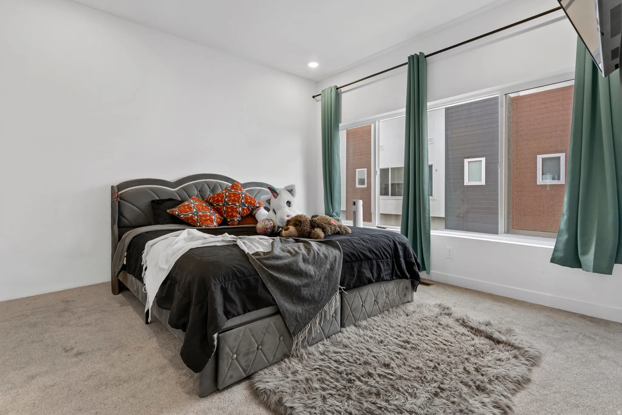 Bedroom with carpet floors and recessed lighting