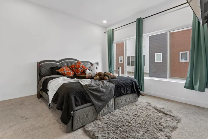 Bedroom with carpet floors and recessed lighting