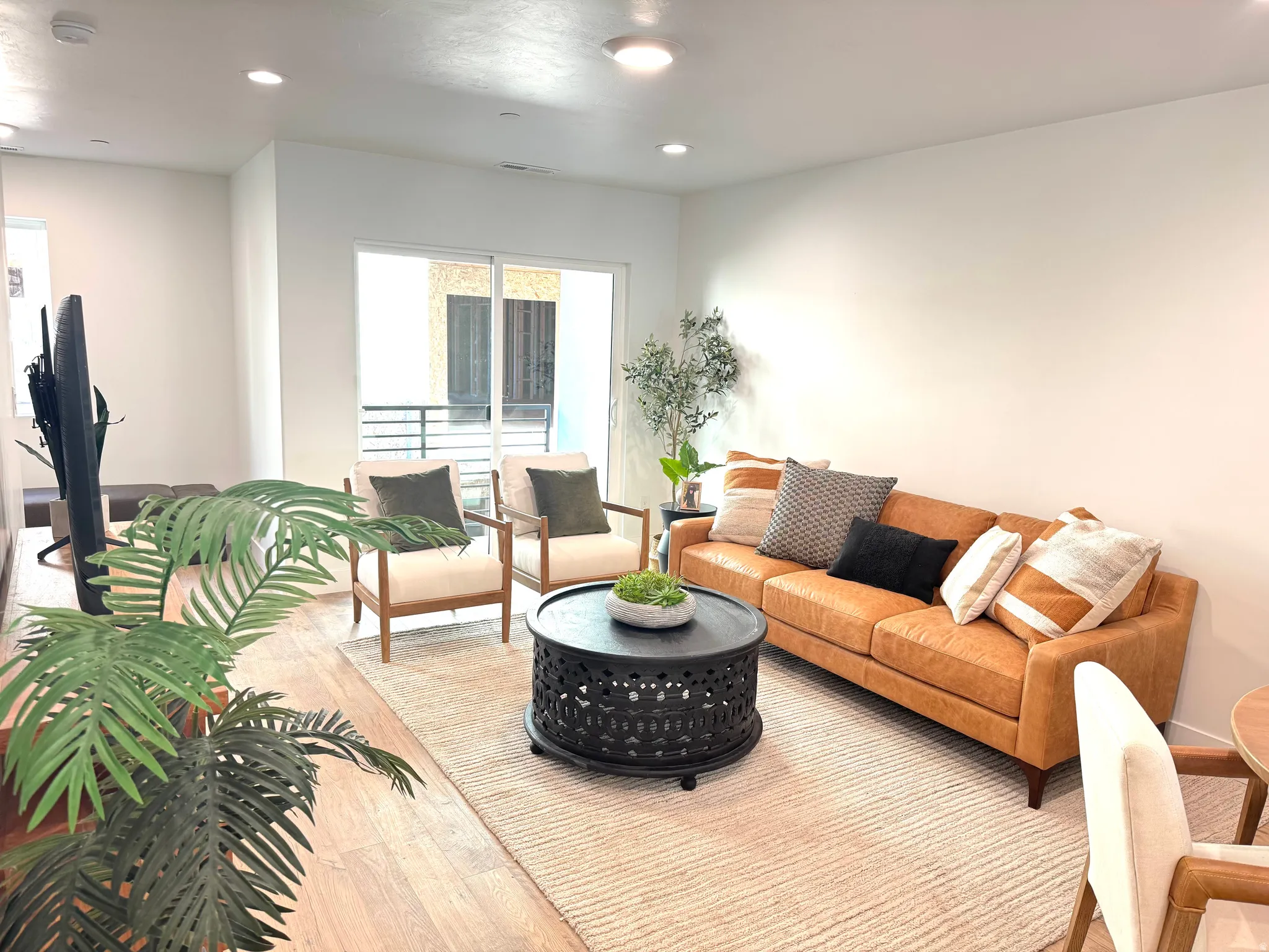 Living area featuring recessed lighting and light wood-style floors