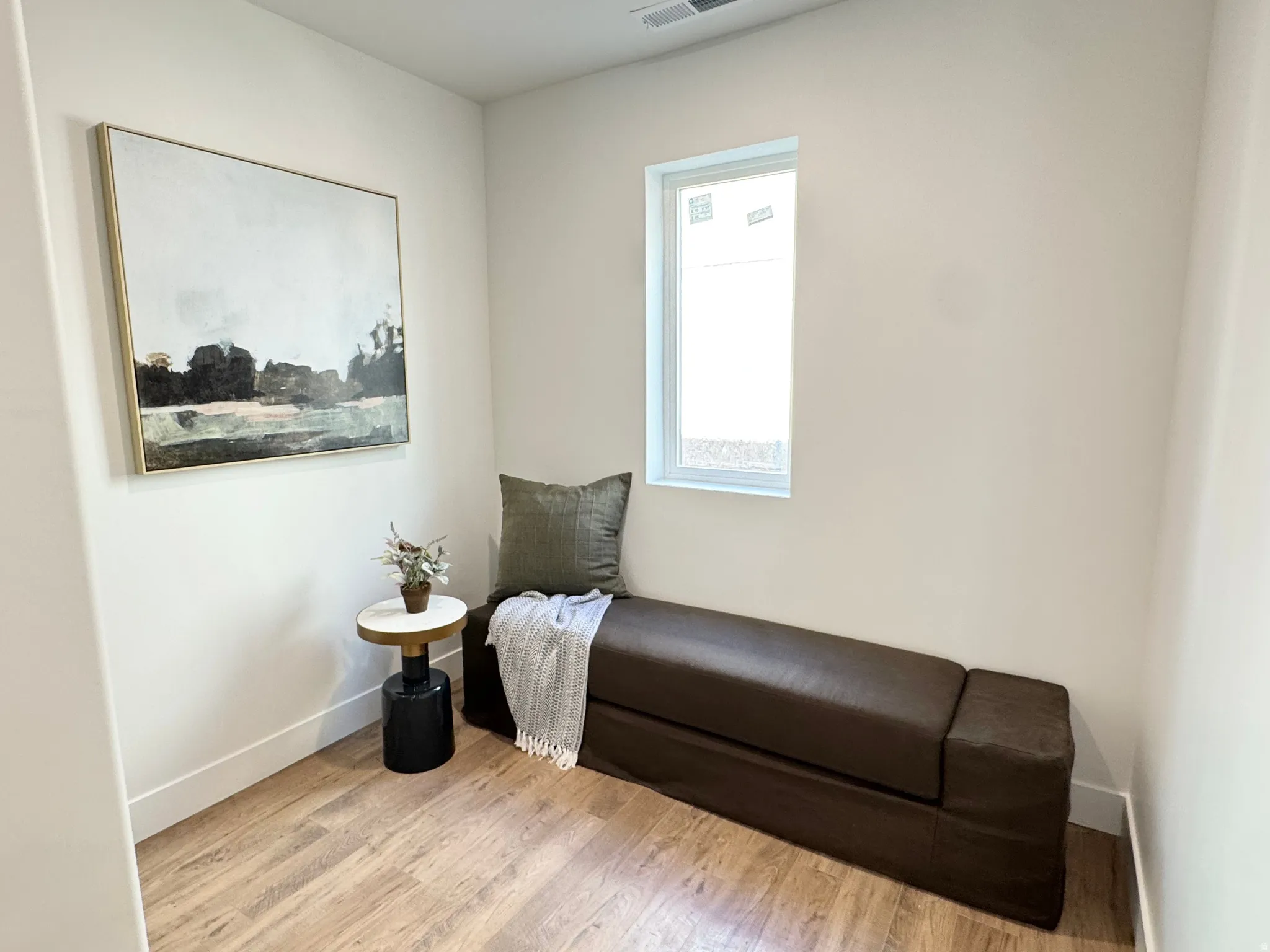 Sitting room with light wood-style flooring