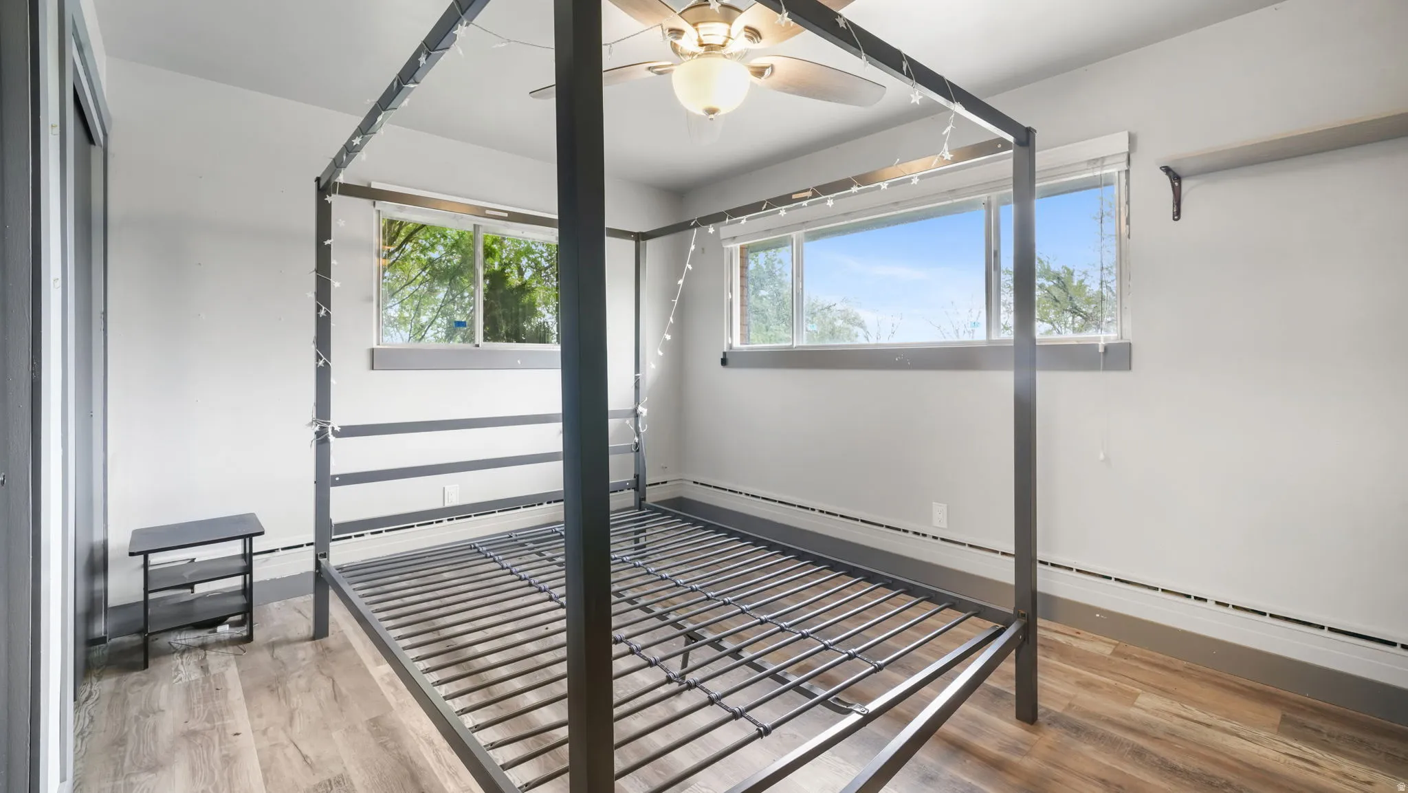 Unfurnished sunroom featuring baseboard heating