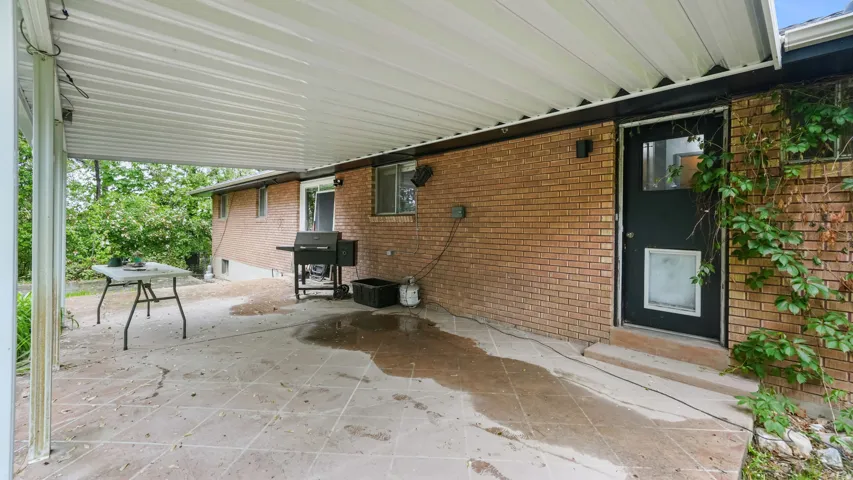 View of patio featuring area for grilling