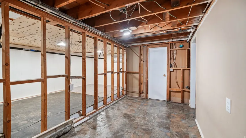 Unfinished below grade area featuring stone finish floors