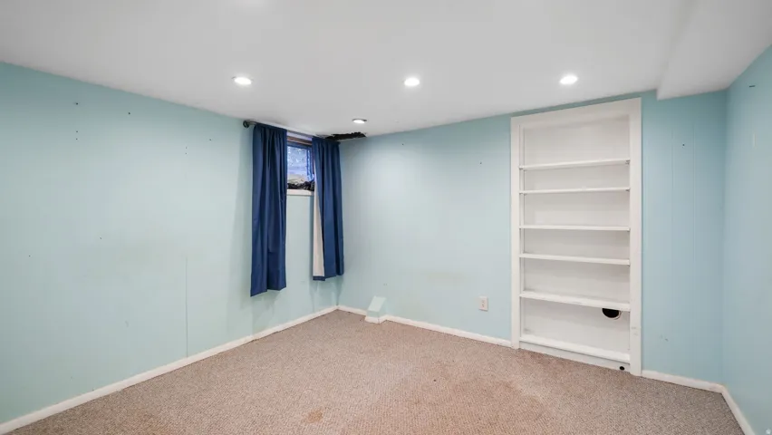 Unfurnished bedroom featuring recessed lighting and carpet flooring
