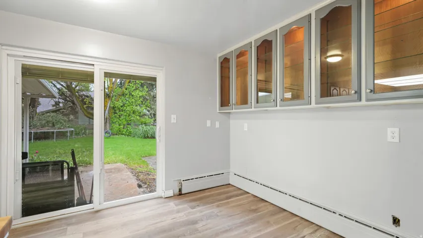 Entryway featuring wood finished floors and baseboard heating
