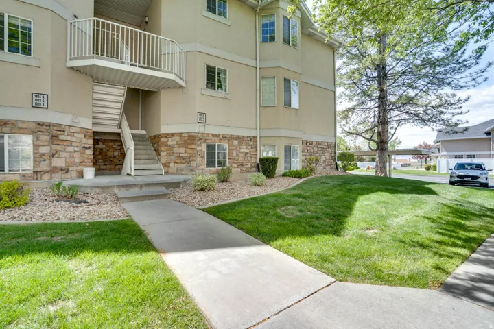 View of apartment building / complex featuring stairs