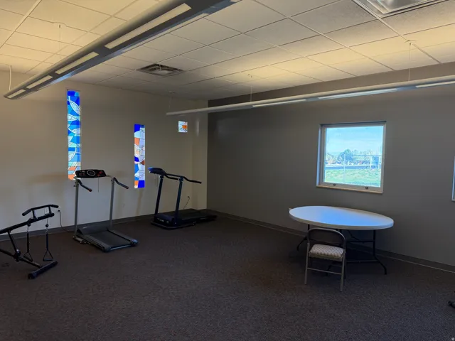 Exercise room with a paneled ceiling