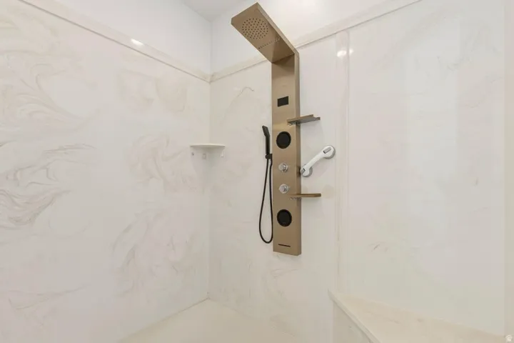Full bathroom featuring a marble finish shower