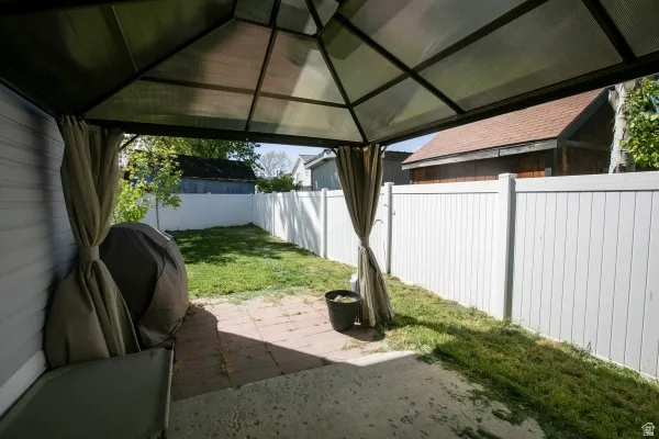 Fenced backyard featuring a patio area