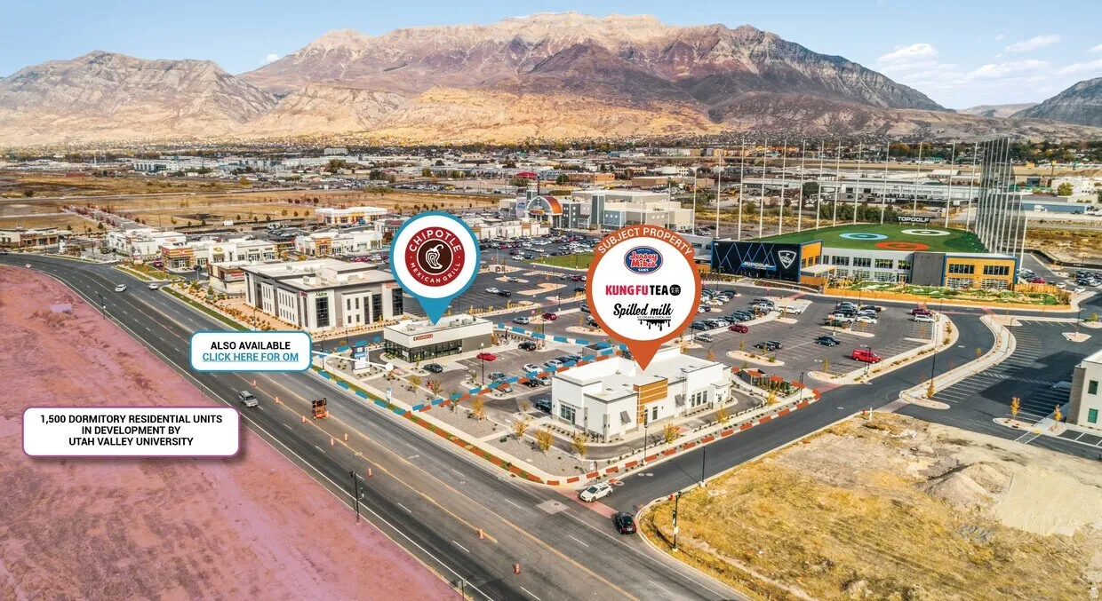 Bird's eye view of mountains and a commercial area