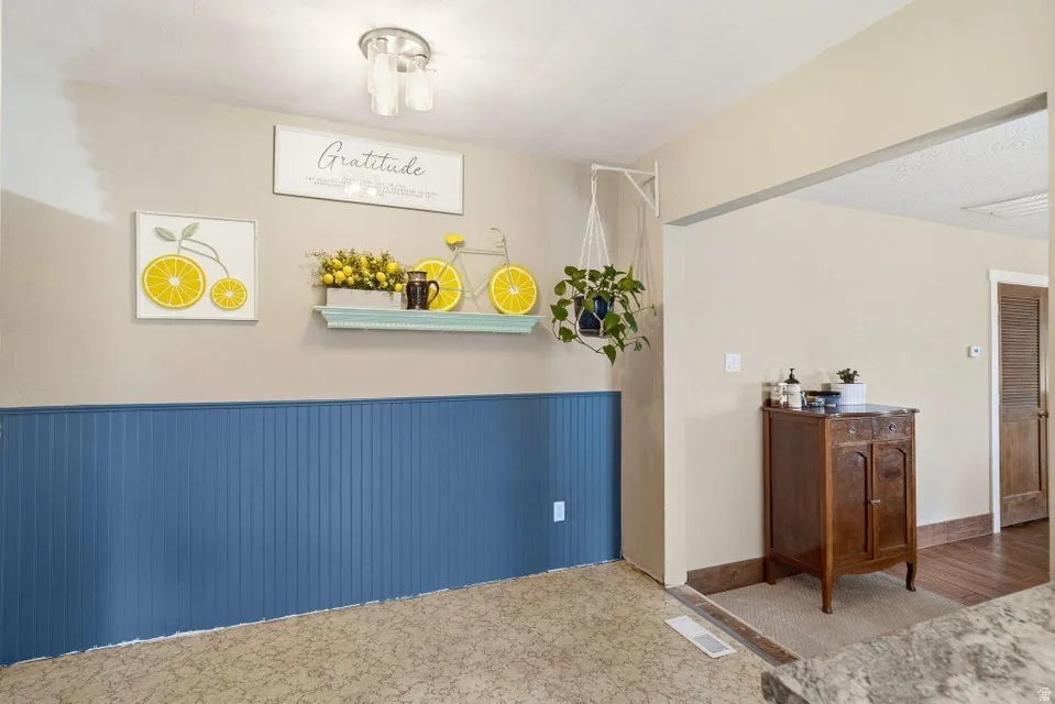 Bedroom featuring wainscoting