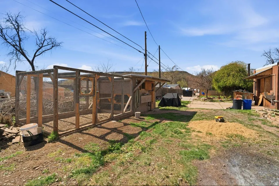 View of yard featuring exterior structure and an outdoor structure