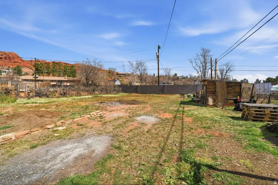 View of fenced backyard