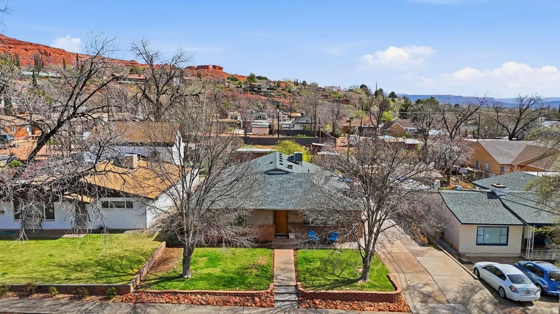 Aerial perspective of suburban area featuring a mountainous background