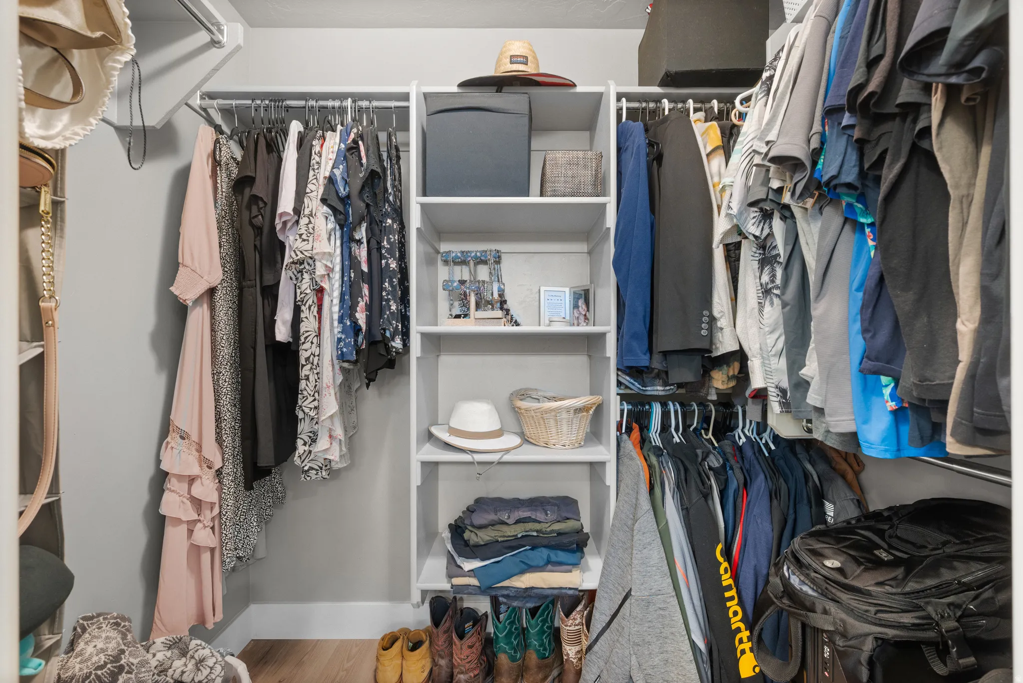 Walk in closet featuring wood finished floors