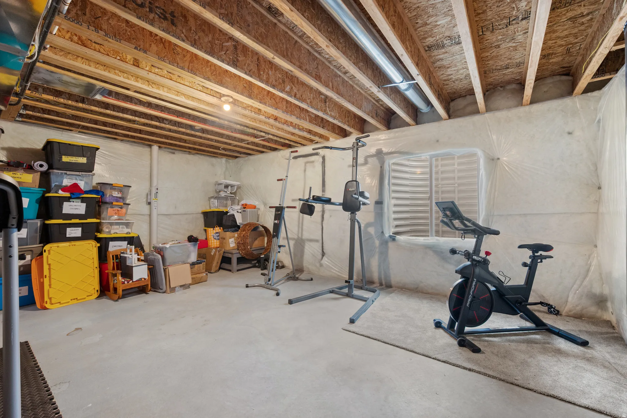 Exercise room featuring concrete floors