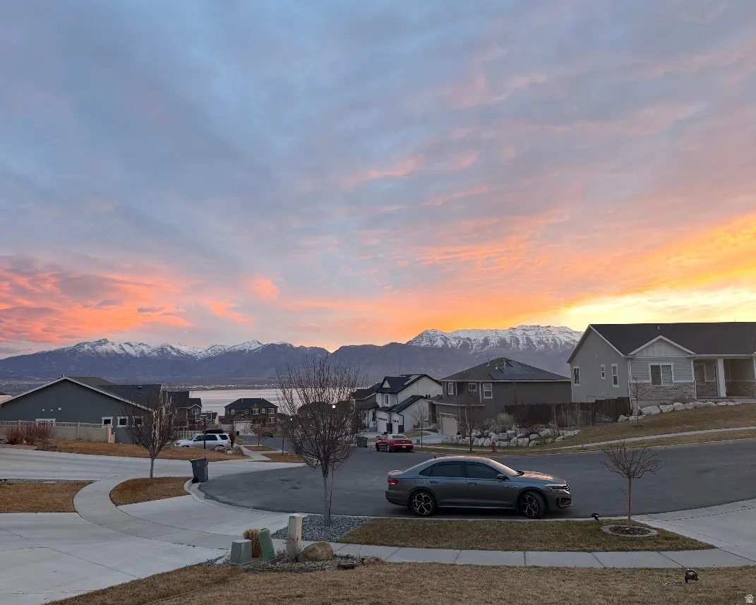View of street featuring a residential view, a mountain view, and sidewalks