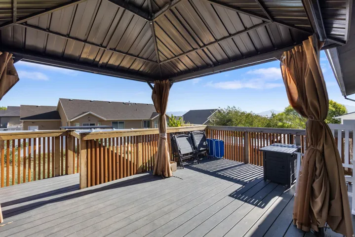 Expansive outdoor deck featuring composite decking and wood railing
