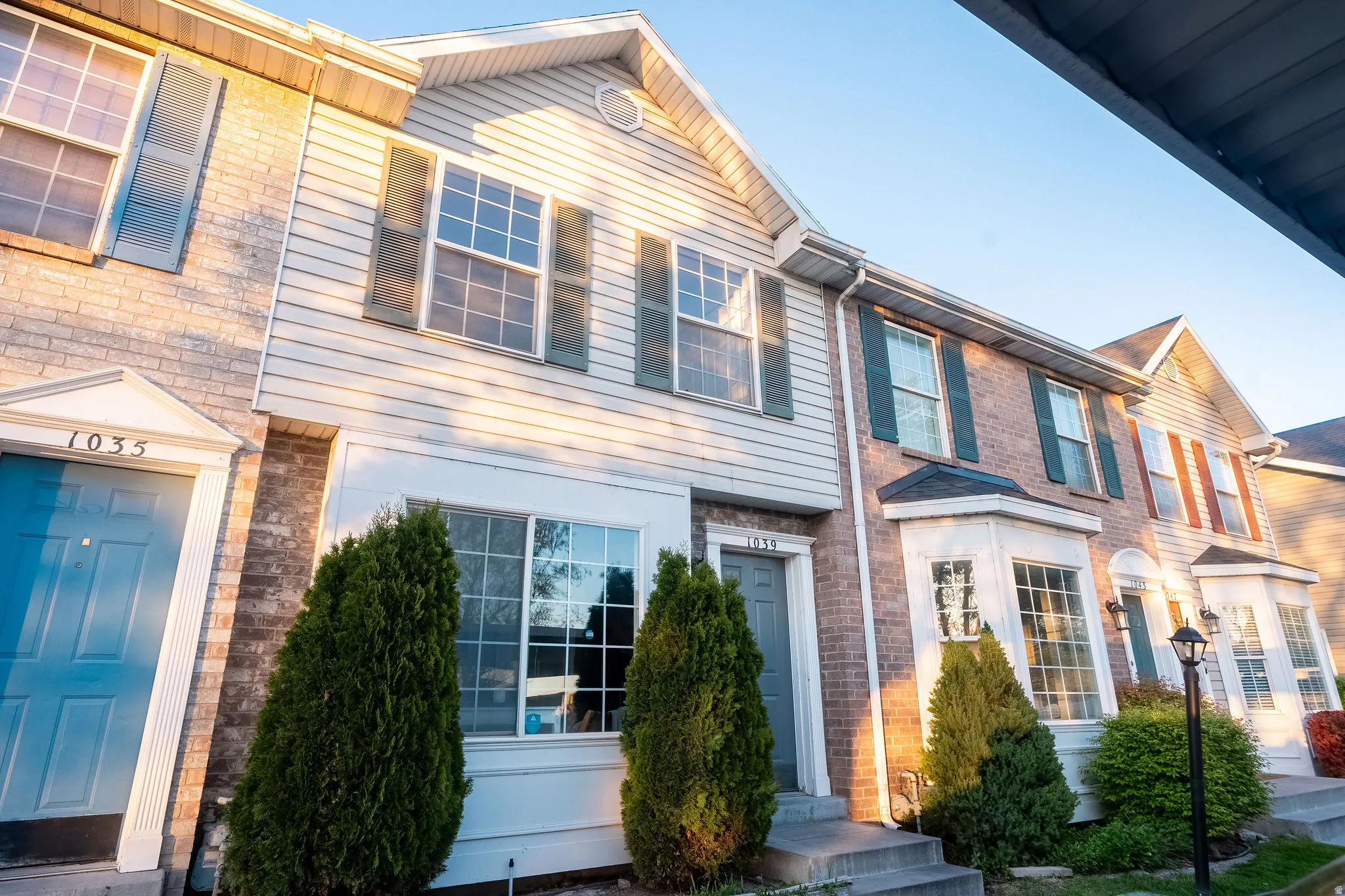 View of front of house with brick siding