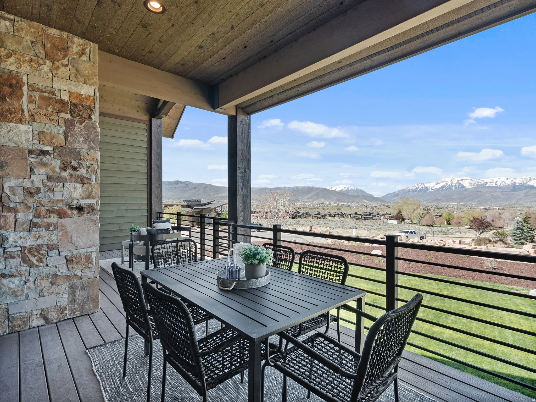 Deck featuring outdoor dining space and a mountain view