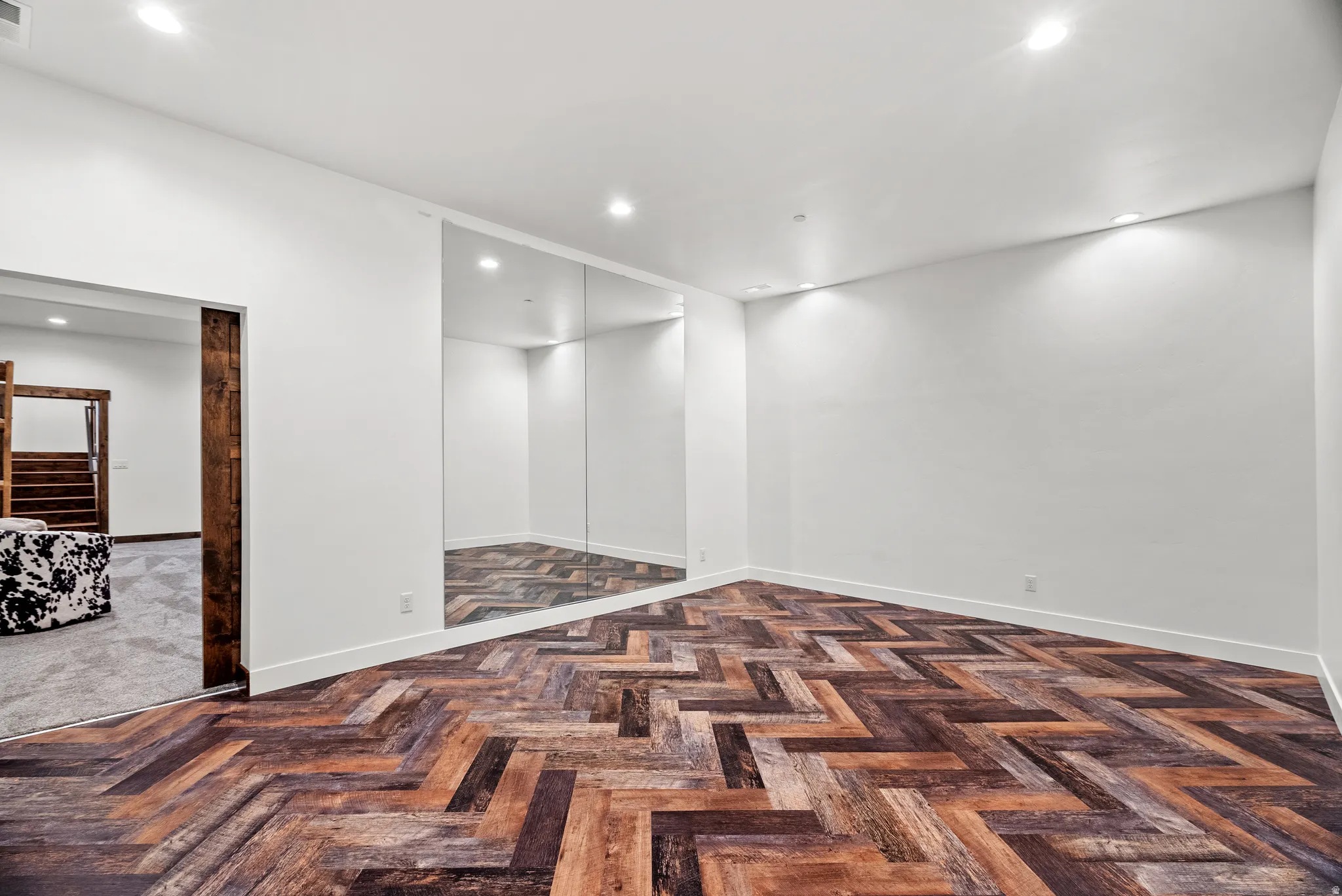 Unfurnished room featuring recessed lighting and parquet floors