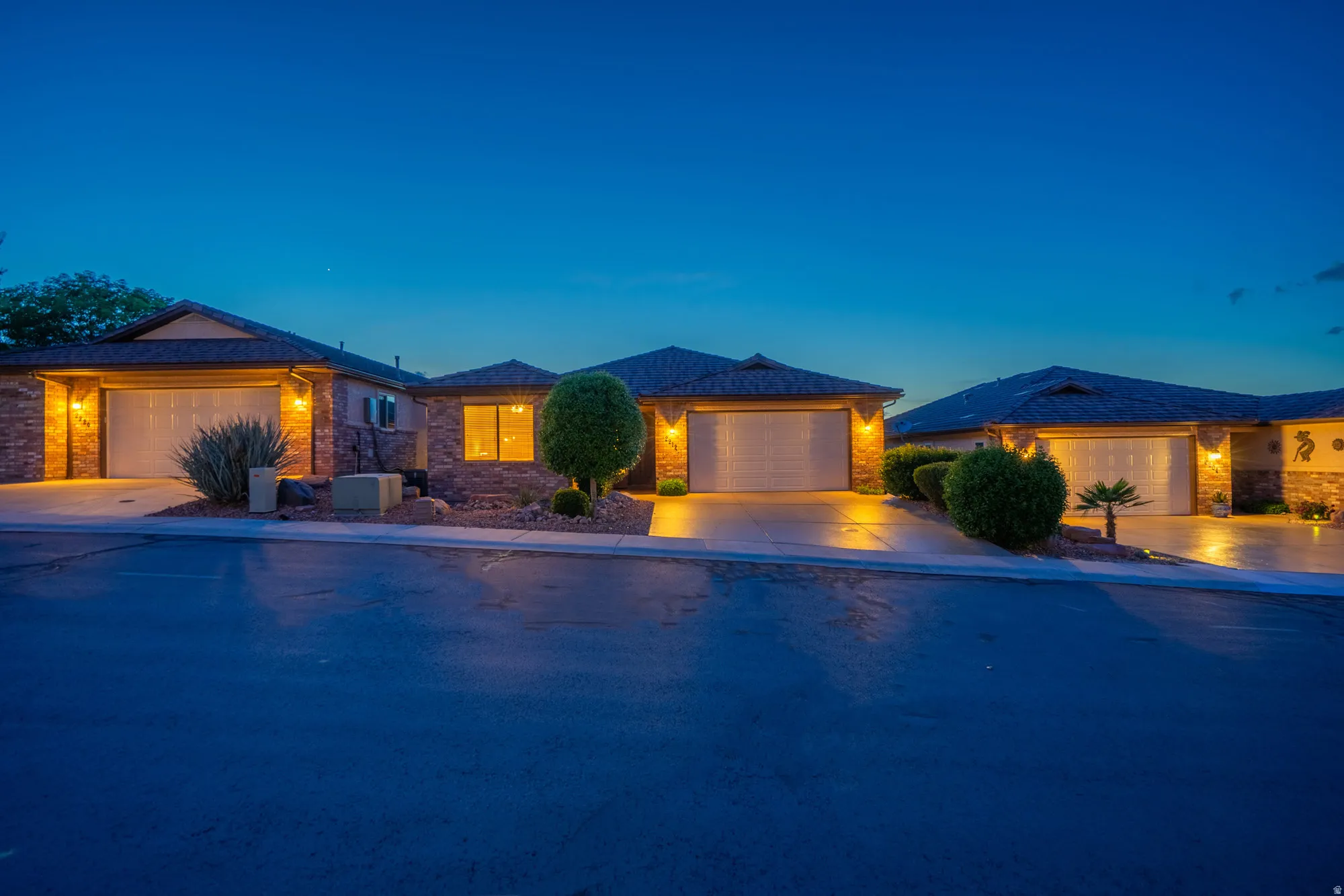 View of front of home with a garage and concrete driveway